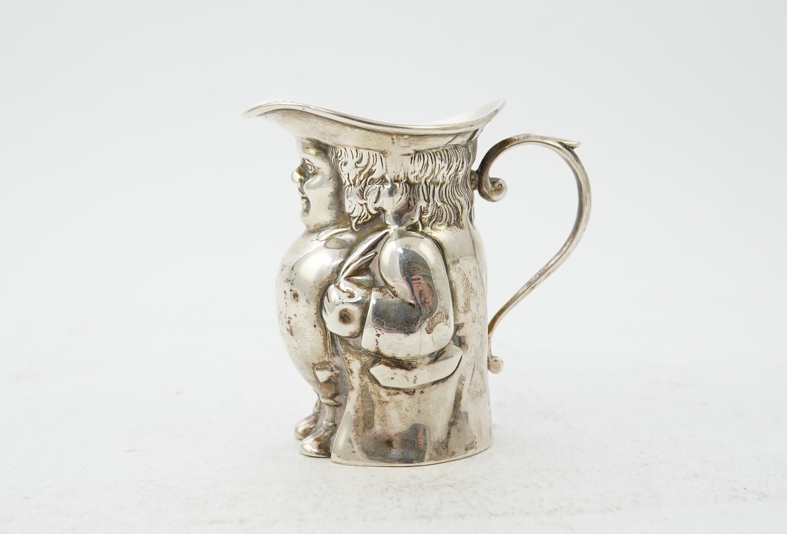 A George V novelty silver cream jug, modelled as a Toby Jug, by Hayes & Co